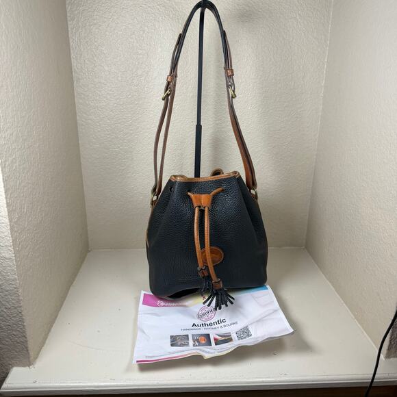 Dooney & Bourke Handbags - EUC Dooney Bourke vintage drawstring bucket bag with COA